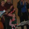 12-11-10 Cades Cove Preservation Christmas Party. Savanna, Mark Snyder & Dr. Harlan singing with the group